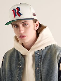 Rhude is always reinventing its logo in effortlessly cool ways. Embroidered with a 'Double R' monogram, this flat-brimmed baseball cap is made from twill and appliquéd with a striped star patch at the side. Adjust the fit using the snap closure. Casual Flat Brim Hat With Letter Patch, Casual Fitted Hat With Flat Crown For Streetwear, Casual Baseball Cap With Logo Patch And Flat Brim, Casual Flat Crown Hat For Streetwear, Casual Flat Brim Hats For College, Casual Baseball Cap With Letter Embroidery And Flat Bill, Urban Fitted Hat With Embroidered Logo And Curved Brim, Flat Cap For Baseball Season Streetwear, Collegiate Flat Bill Trucker Hat For Streetwear