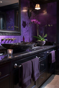 a bathroom with two sinks and purple walls