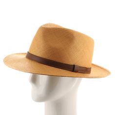 ↑ Click above to watch the video! ↑ Malta Sienna is a modern fedora with a tall hand-blocked teardrop crown that features a stiffened medium brim, sleek leather strap hatband, and beautiful sienna-colored straw. The brim contains a wire to hold its shape. This item is a genuine Panama Hat handwoven in Ecuador. Material: 100% Toquilla StrawBrim: 2 3/4"Crown: 4 1/2" teardropHatband: 5/8" leatherClimate: Sun Handwoven in Ecuador. Hand-finished in the US. Measurements are approximate, this is a hand Modern Fedora With Short Brim For Everyday, Modern Adjustable Brimmed Fedora, Modern Adjustable Fedora, Classic Flat Brim Panama Hat For Everyday, Classic Wide Brim Fedora For Everyday, Western Style Everyday Fedora, Classic Panama Hat With Flat Brim For Everyday, Everyday Western Style Fitted Fedora, Elegant Solid Fedora For Everyday Wear