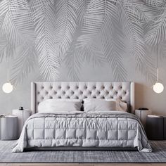 a bedroom with a bed, nightstands and palm leaves on the wall behind it