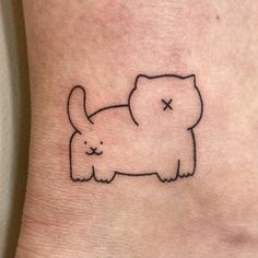 a small cat tattoo on the ankle that looks like it has been drawn by someone