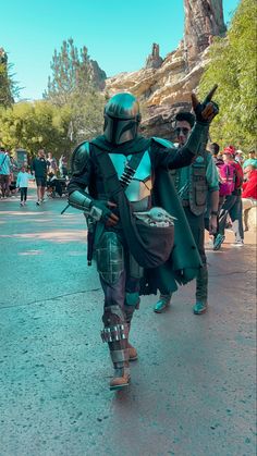 two people in costume walking down the street