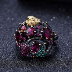 Material: 925 Sterling Silver, Gold PlatedRhodolite Garnet, Lab Created Ruby, Nano EmeraldChrome Diopside, Nano EmeraldTopaz, Nano Emerald, Nano SapphireWeight: 6.6gDesign: Flowers, Leaves and a Bee on a Branch RingColor: Pink, Green, Blue, Black, Yellow GoldPart of Rockland Earrings and Ring Set Branch Rings, Travel Inspired Jewelry, Swiss Blue Topaz Ring, Branch Ring, Gold Bee, Laura Geller, Rhodolite Garnet, Cow Boy, Handmade Gold