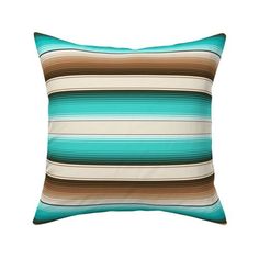 a blue and brown striped pillow on a white background