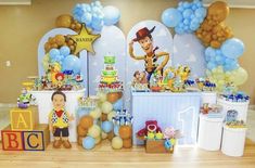 a toy story birthday party with balloons and decorations