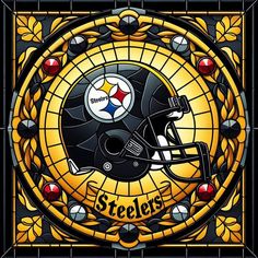 a stained glass window with a pittsburgh football helmet on it's front and side