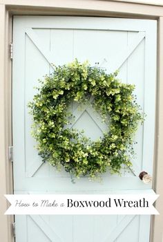 a white door with a wreath on it and the words bowwood written in black