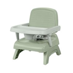 a green high chair that is sitting on top of a white surface with the seat up