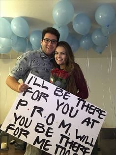 a man and woman holding a sign that says life be there for you at prom