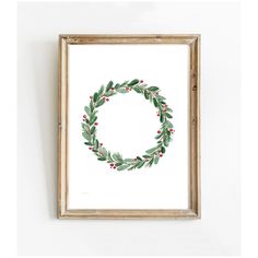 a watercolor christmas wreath with red berries and green leaves is hanging on the wall