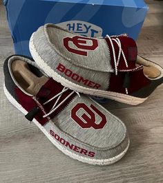 Custom Oklahoma Sooners Heydudes would be perfect for showing team pride! These shoes could feature the iconic  OU logo, making them ideal for football fans to wear on game days or any casual occasion. Upgrade your footwear collection with these unique, stylish, and comfortable shoes! Collegiate Low-top Sneakers For Game Day, Casual Low-top Sneakers For Game Day, Ou Sooners, Hey Dudes, Oklahoma Sooners, Delray Beach, Football Fans, Slip Ons, Oklahoma