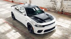 a white and black car parked in a garage