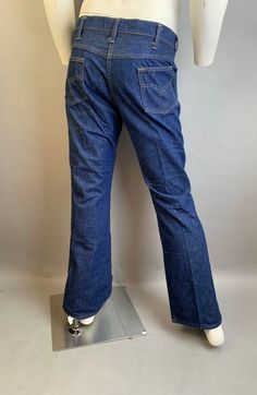 Vintage 80s denim jeans in excellent condition size large Waist 36 inches Hip 38 Inseam 31 Retro Flare Jeans In Dark Wash Rigid Denim, Retro Dark Wash Rigid Denim Flare Jeans, Retro Denim Flare Jeans With Pockets, Retro Denim Jeans With Pockets, Retro Medium Wash Cotton Jeans, Retro Dark Wash Rigid Denim Jeans, Retro Rigid Denim Blue Jeans, Retro Medium Wash Jeans With Pockets, Retro Denim Blue Cotton Jeans