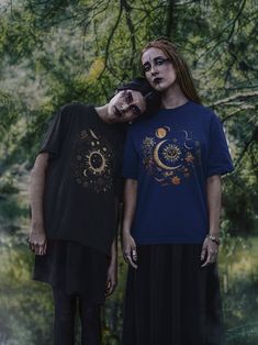 Looking for a unique and stylish t-shirt that is out of this world? This celestial art t-shirt is just what you need! Featuring a striking black background and shimmering gold tones, this t-shirt captures the beauty and mystery of the night sky in a way that is both elegant and eye-catching. Whether you're a fan of astrology, and astronomy, or just love the beauty of the cosmos, this shirt is sure to turn heads and start conversations. Made with high-quality materials and designed to fit comfortably and flatteringly, this celestial art t-shirt is the perfect way to show off your love for the stars. Whether you wear it out on the town or just lounging at home, it is sure to become a favorite in your wardrobe. So why wait? Order your celestial art t-shirt today and start adding some cosmic f Astronomy Lover, Celestial Art, Art T Shirt, Sun And Moon, Star Shirt, Out Of This World, Gold Fashion, Gold Stars, Night Sky