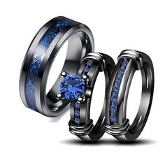 two black rings with blue sapphire stones in the center and one is made out of stainless steel