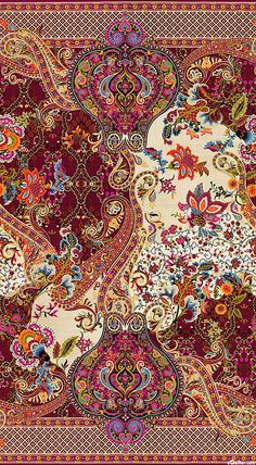 an intricately designed carpet with many colors and patterns