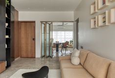 the living room is clean and ready for us to use as a dining area in this modern home