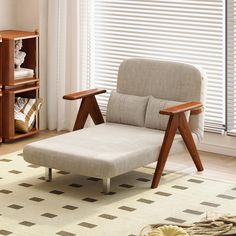 a living room scene with focus on the chaise lounge chair and bookshelf