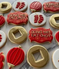 decorated cookies with red and white frosting on a marble counter top, along with the words going he eat glob