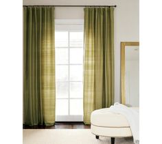 the curtains in this room are green and white