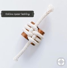 an image of a rope that has been tied to the ground and is on top of a white surface