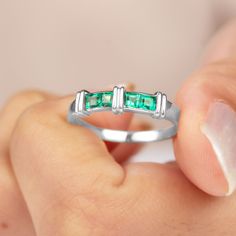 Product Details The perfect fusion of modern sophistication and timeless allure this Emerald Band Ring elevates your style. This stunning band features Princess Cut Emerald in Channel Setting that highlights their striking green brilliance. The green vibrant color offers a seamless and contemporary look that pairs effortlessly with any outfit. Ideal for stacking, as a wedding band or as a statement piece on its own, this Princess Cut Emerald Ring brings a touch of glamour and elegance to every o Princess Cut Emerald Wedding Ring Birthstone, Princess Cut Emerald Jewelry For May Birthstone, Emerald Birthstone Ring For Anniversary, Princess Cut, Green Princess Cut Birthstone Jewelry, Green Emerald-cut Channel Set Jewelry, Emerald Band Ring, Emerald Band, May Birthday, Channel Setting