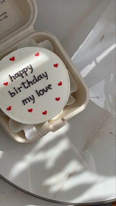 a birthday cake in a box with the words happy birthday my love written on it