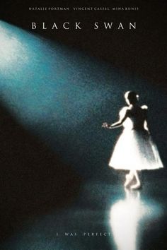 a woman in a white dress standing under a spotlight on a dark stage with her arms outstretched