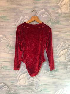 "Vintage 80's 90's Velvet Red Leotard One Piece Body Suit Long Sleeves Size Medium Label size: M Measurements (lyin flat): Shoulders: 14,5\" / 37 cm Waist : 12.5\" / 32 cm Sleeve: 21.5\" / 55 cm Length on the side: 18,5\" / 47 cm Please check measurements to insure a proper fit. Remember to allow yourself some extra room for movement. You can compare these with something from your closet that fits you well. Condition: Good Vintage Condition SHIPPING * I ship worldwide via Priority mail (Latvijas Long Sleeve Bodysuit For Dance, Solid Color Long Sleeve Bodysuit For Dance, Long Sleeve Leotard For Dance, Solid Long Sleeve Bodysuit For Dance, Red Fitted Bodysuit For Winter, Fitted Red Bodysuit For Winter, Red Fitted Long Sleeve Bodysuit, Red Bodysuit For Fall Party, Red Long Sleeve Fitted Bodysuit