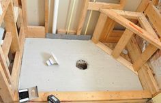 an overhead view of a bathroom being built with wood framing around the floor and walls