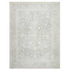 a rug with an intricate design on the front and back side, in grey tones