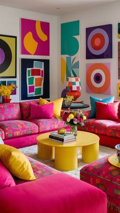 a living room filled with colorful furniture and paintings on the wall above it's coffee table