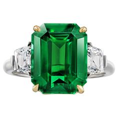 7.02 carat Emerald Cut Green Tsavorite with French Cut Trapezoid Diamonds weighing .86 carats set in a Platinum and 18k Yellow Gold ring. Beryl Ring, Emerald Green Inspiration, Natural Emerald Rings, Jewels Rings, French Cut, Contemporary Ring, Expensive Jewelry, 18k Yellow Gold Ring, Engagement Ring Cuts