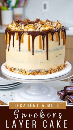 a cake sitting on top of a white plate covered in chocolate and caramel drizzle