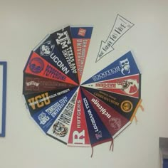 a clock made out of several different types of stickers on the side of a wall