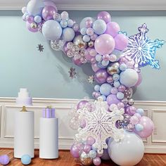 balloons and snowflakes are arranged on the floor