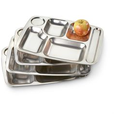 three metal trays with apples on them