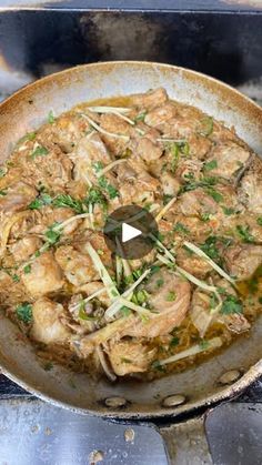 a skillet filled with food cooking on top of a stove