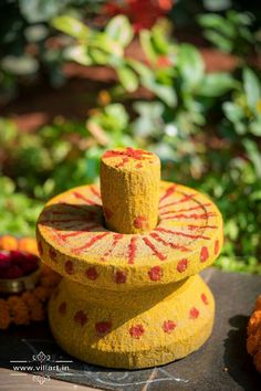 a yellow and red object sitting on top of a table