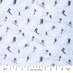 a group of people riding skis down a snow covered slope