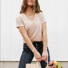 The Boone Top Is A Short Sleeve Ribbed Top With A V-Neckline In A Beautiful Blush. This Top Is A Great Layering Top! Material Content: 61% Polyester // 33% Rayon // 6% Spandex Length Measurements Are Taken From The Top Of The Shoulder To The Bottom Hem Laying Flat Medium: Bust: 38" // Length: 25.5" Feminine Short Sleeve V-neck Top, Beige V-neck Top For Summer, Spring Everyday V-neck Top, Chic Summer V-neck Top For Everyday, Feminine Beige V-neck Top, Chic Pink V-neck Top For Spring, Trendy Pink V-neck Top For Spring, Layered Tops, Ribbed Top