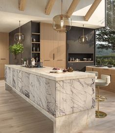 a large kitchen with marble counter tops and wooden floors