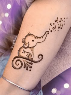 an elephant with music notes on it's arm