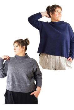 two women wearing sweaters and shorts, one with her hands on her head while the other has her hand on her hair