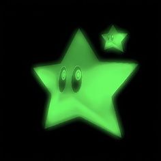 a green star with speakers on it in the dark