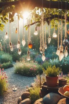 the sun shines brightly through hanging lights above a garden filled with flowers and fruit