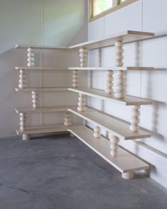 some shelves are lined up against the wall