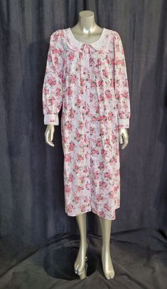 Indulge in vintage charm with this Cypress pink floral cotton gown/robe. The women's size S gown features a comfortable fit for regular size types and is made of soft cotton material that feels gentle on the skin.  The pink floral design adds a touch of elegance to the gown/robe, making it ideal for vintage lingerie enthusiasts. This vintage piece is a must-have for anyone who loves unique clothing, and it's ready to become a part of your vintage collection. New without tags.  Measured lying fla