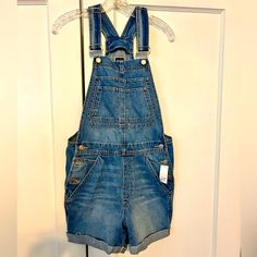 New With Tags Gap Blue Denim Shortalls In A Ladies Size Xs. 4” Inseam. Measure 18.5” Across Widest Point At Hips. Dark Wash High Rise Denim Shortalls, High Rise Dark Wash Denim Shortalls, Blue Denim Utility Shortalls, Womens Denim Overalls, Denim Shortalls, Black Denim Overalls, Denim Overalls Shorts, Black Overalls, Jean Overalls