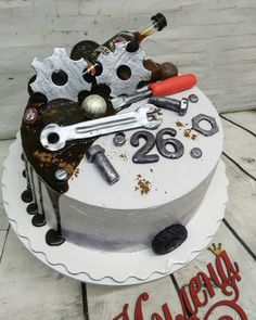 a birthday cake with an assortment of tools on it